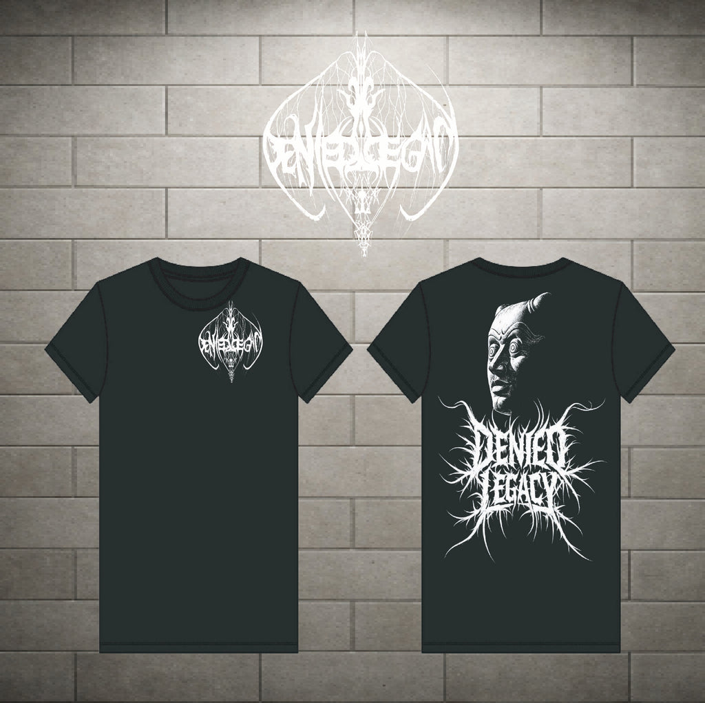 Two black short-sleeve t-shirts shown against a gray brick wall background, displaying the front and back designs. The front features a small white circular logo on the left chest, and the back features a large white graphic of a face with the text 'Denied Legacy' in a spiky font.