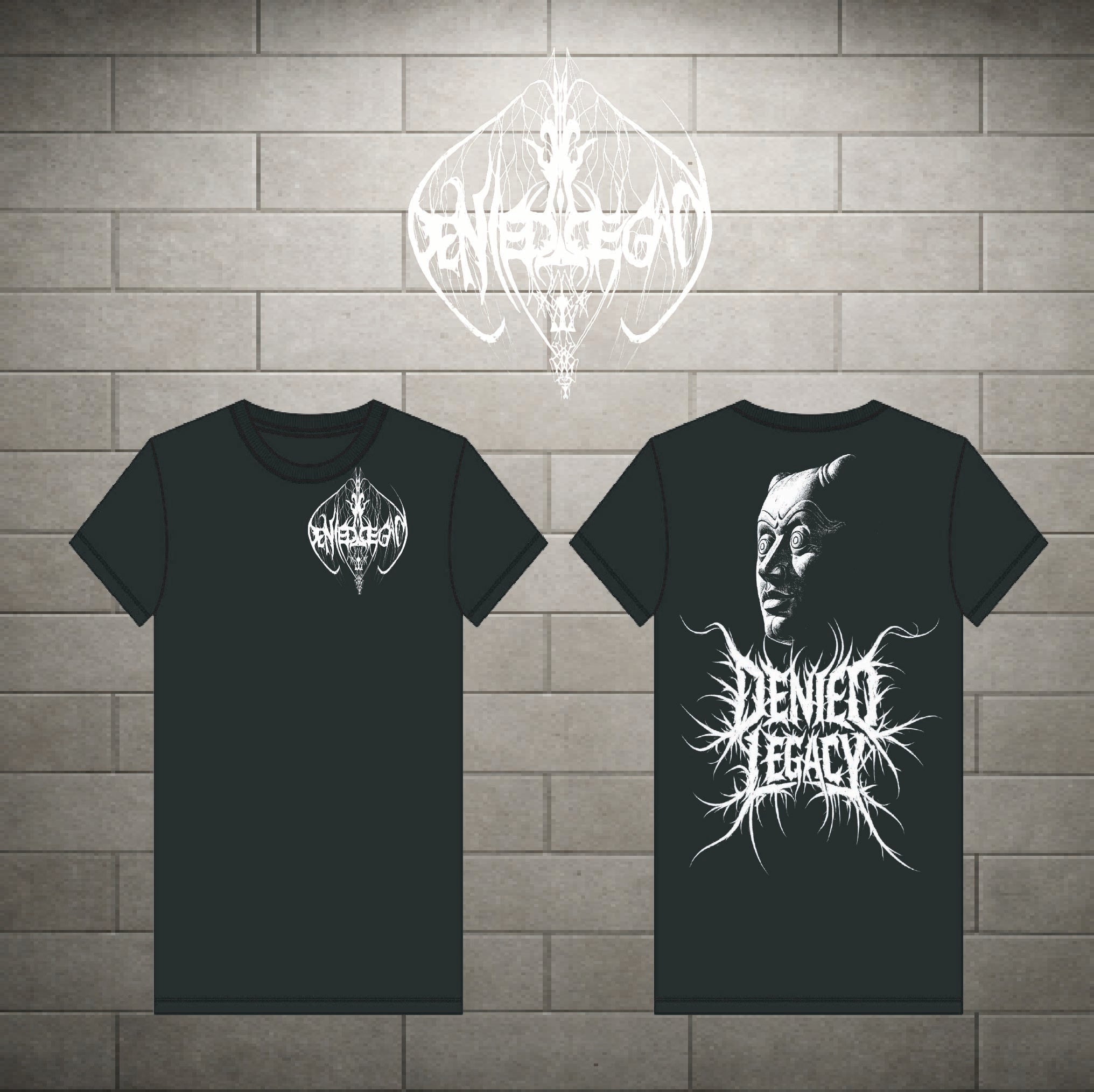 Two black short-sleeve t-shirts shown against a gray brick wall background, displaying the front and back designs. The front features a small white circular logo on the left chest, and the back features a large white graphic of a face with the text 'Denied Legacy' in a spiky font.