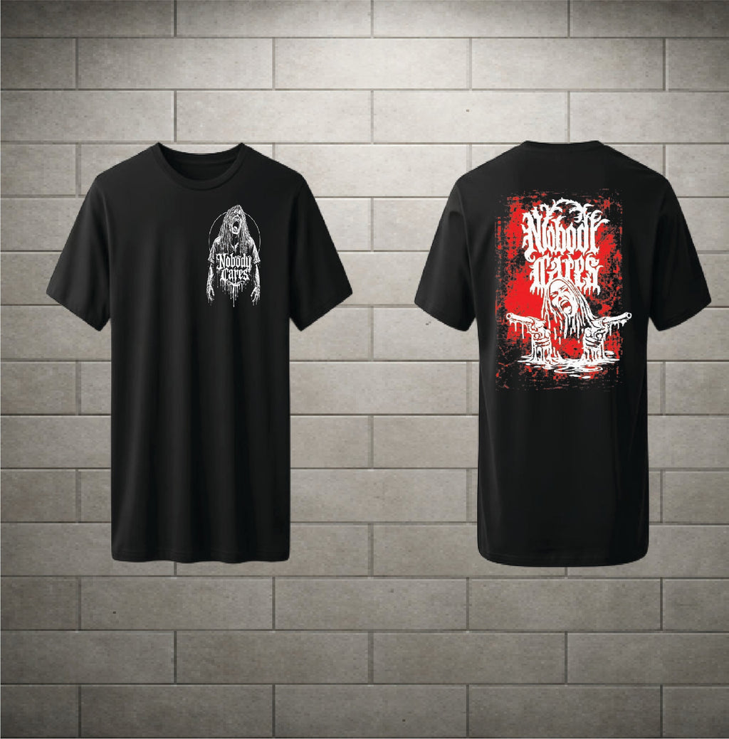 Two black short-sleeve graphic T-shirts shown against a gray brick wall background, displaying the front and back designs. The front features a white graphic of a hooded figure with the text 'WE ARE NOT A VETERAN'.