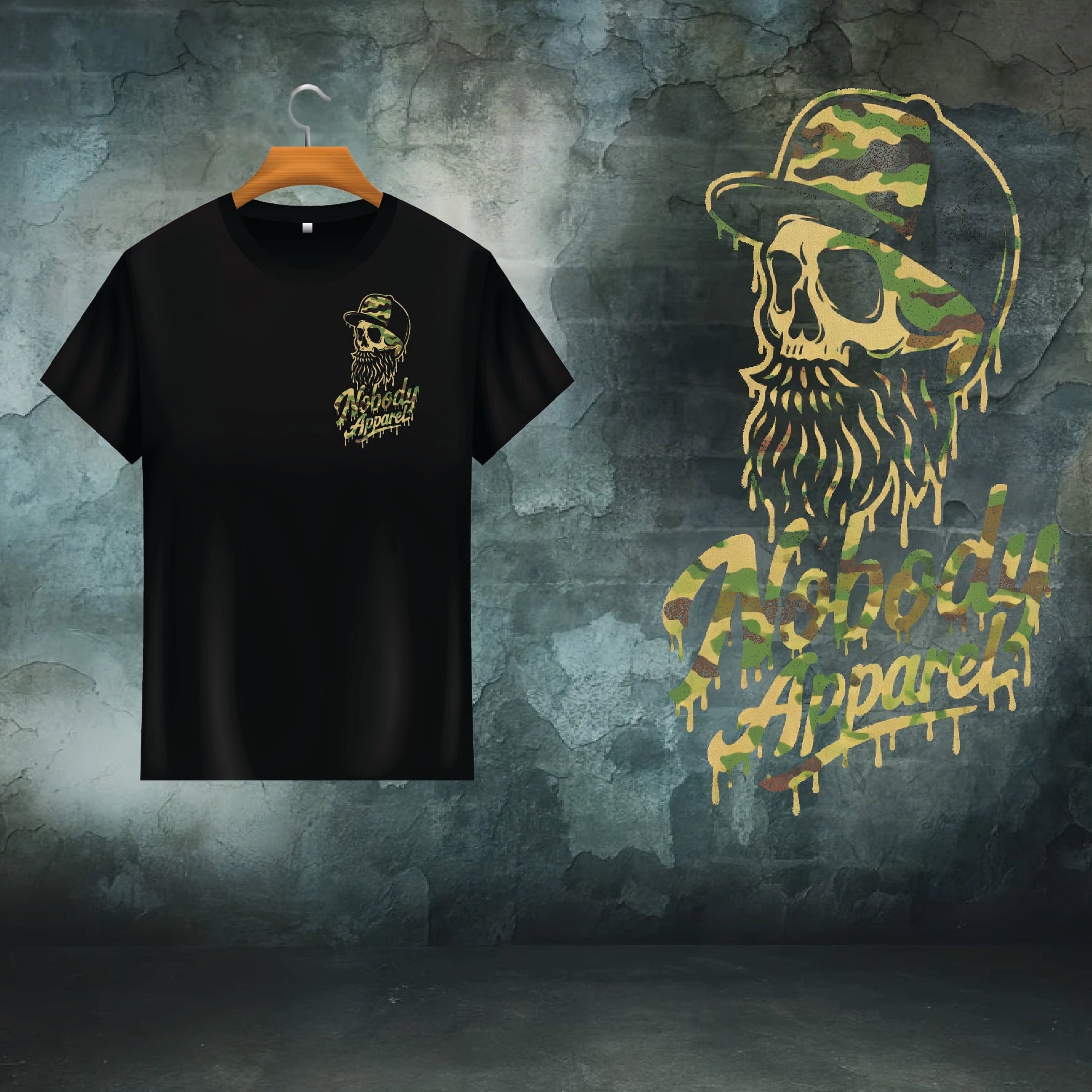 Black t-shirt with a graphic design of a skull with a beard and camouflage hat, displayed on a hanger against a textured green background.