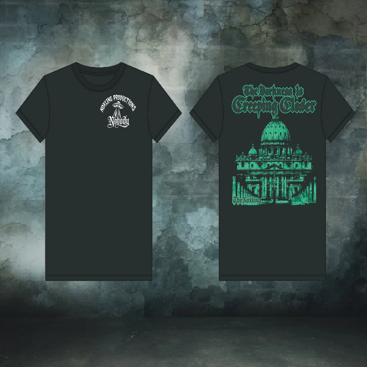 Two black short-sleeve t-shirts shown front and back against a textured dark gray background. The front shirt has a small white circular graphic on the left chest.
